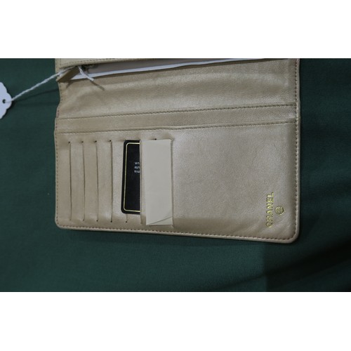 8057 - A Chanel Camellia long wallet in pink lambskin with gold-tone hardware With Chanel authenticity card... 