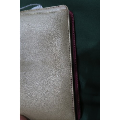 8057 - A Chanel Camellia long wallet in pink lambskin with gold-tone hardware With Chanel authenticity card... 