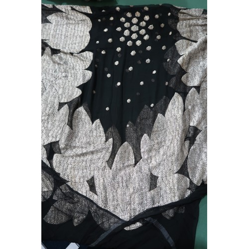 8020 - *Amended* A 1920s fur trimmed black cape by Reville London, a black shawl with silver lamé leaf-patt... 