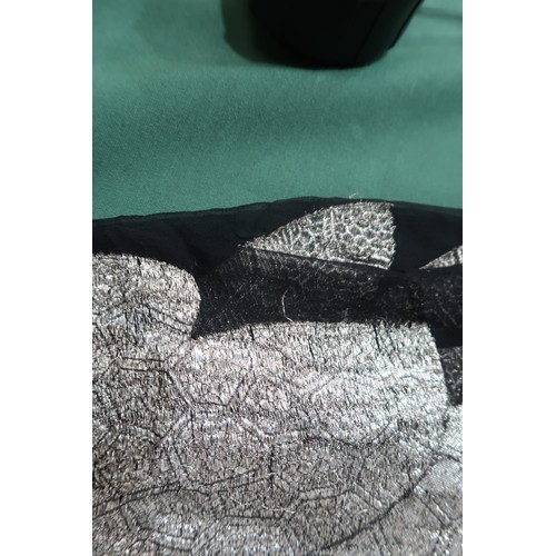 8020 - *Amended* A 1920s fur trimmed black cape by Reville London, a black shawl with silver lamé leaf-patt... 