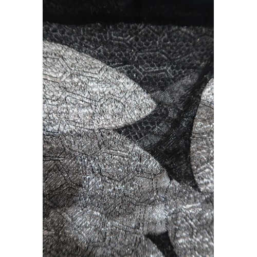8020 - *Amended* A 1920s fur trimmed black cape by Reville London, a black shawl with silver lamé leaf-patt... 