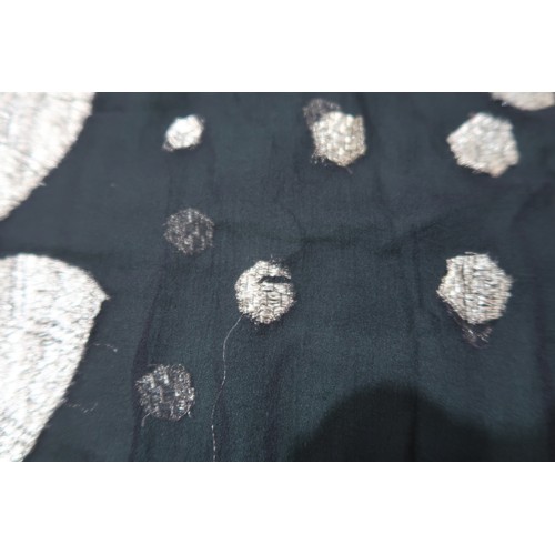 8020 - *Amended* A 1920s fur trimmed black cape by Reville London, a black shawl with silver lamé leaf-patt... 