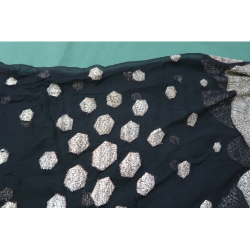 8020 - *Amended* A 1920s fur trimmed black cape by Reville London, a black shawl with silver lamé leaf-patt... 