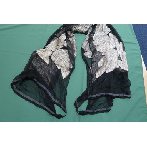 8020 - *Amended* A 1920s fur trimmed black cape by Reville London, a black shawl with silver lamé leaf-patt... 