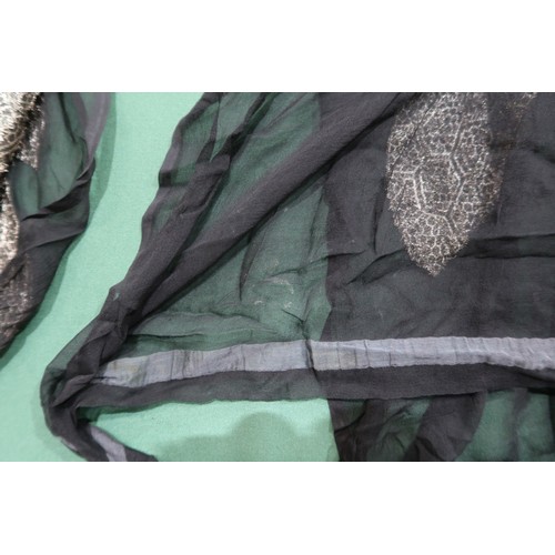 8020 - *Amended* A 1920s fur trimmed black cape by Reville London, a black shawl with silver lamé leaf-patt... 