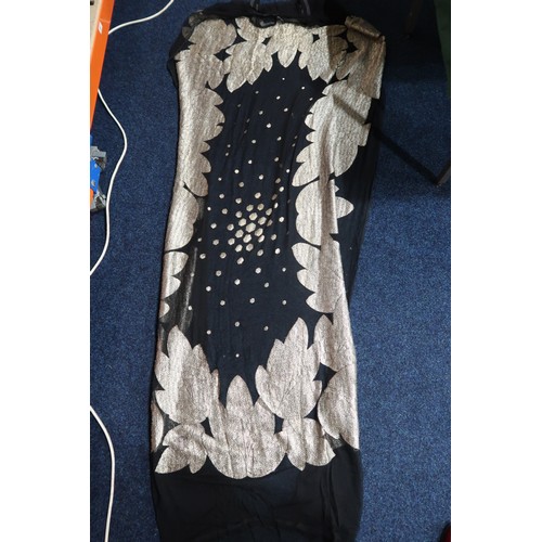 8020 - *Amended* A 1920s fur trimmed black cape by Reville London, a black shawl with silver lamé leaf-patt... 