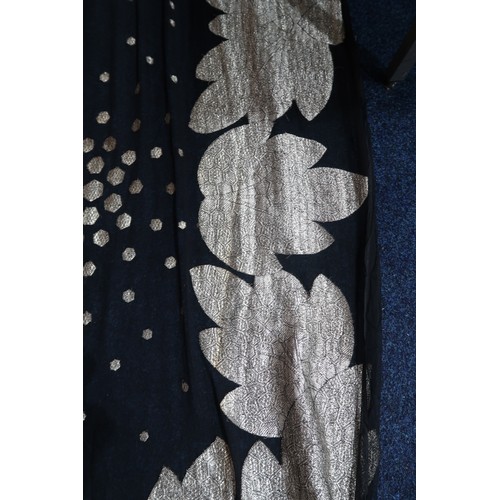 8020 - *Amended* A 1920s fur trimmed black cape by Reville London, a black shawl with silver lamé leaf-patt... 