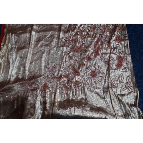 8020 - *Amended* A 1920s fur trimmed black cape by Reville London, a black shawl with silver lamé leaf-patt... 