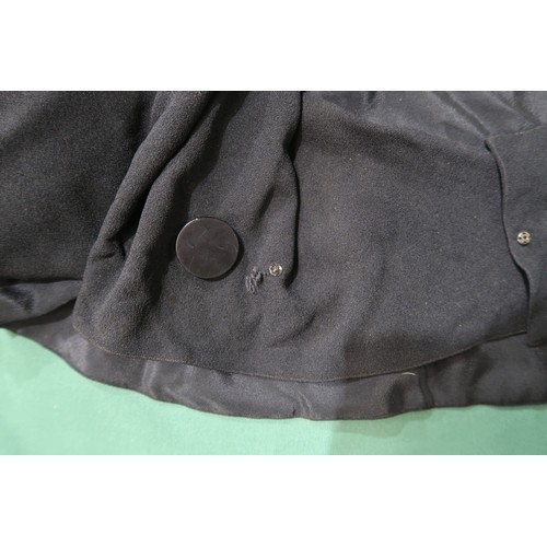 8020 - *Amended* A 1920s fur trimmed black cape by Reville London, a black shawl with silver lamé leaf-patt... 