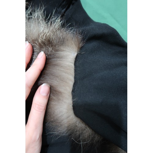 8020 - *Amended* A 1920s fur trimmed black cape by Reville London, a black shawl with silver lamé leaf-patt... 