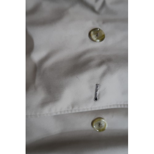 8030 - A vintage Burberry trench coat with belt, lined in nova check pattern