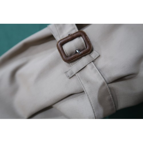8030 - A vintage Burberry trench coat with belt, lined in nova check pattern