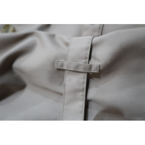 8030 - A vintage Burberry trench coat with belt, lined in nova check pattern