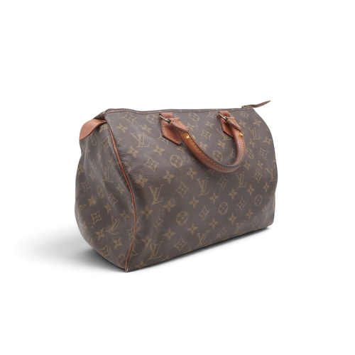 8023 - A vintage Louis Vuitton Speedy 30 handbag in monogrammed coated canvas with vachetta leather trims