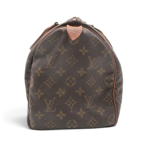 8023 - A vintage Louis Vuitton Speedy 30 handbag in monogrammed coated canvas with vachetta leather trims