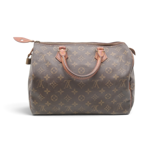 8023 - A vintage Louis Vuitton Speedy 30 handbag in monogrammed coated canvas with vachetta leather trims