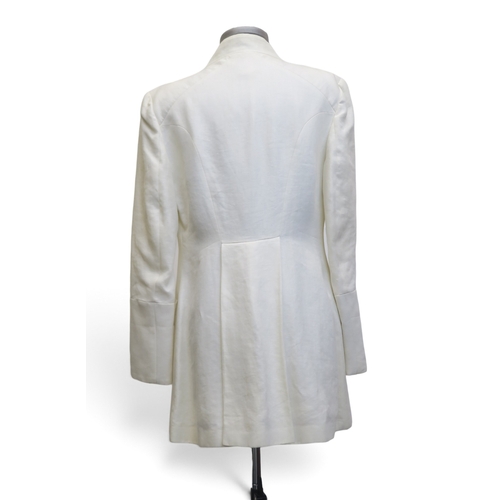 8017 - A white fur jacket and a Bazar de Christian Lacroix linen long jacket (2)