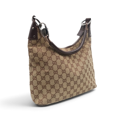 8029 - A Gucci GG shoulder bag in monogram jacquard canvas with brown leather trims and strap and silver-to... 