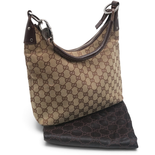 8029 - A Gucci GG shoulder bag in monogram jacquard canvas with brown leather trims and strap and silver-to... 