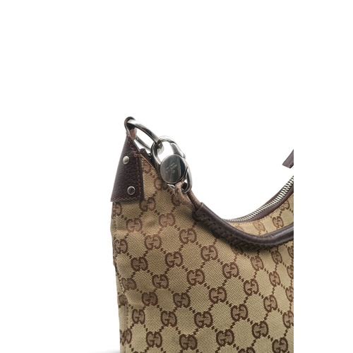 8029 - A Gucci GG shoulder bag in monogram jacquard canvas with brown leather trims and strap and silver-to... 