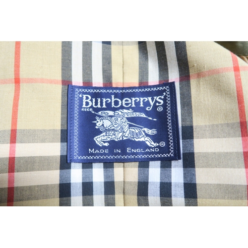 8032 - A vintage Burberry trench coat in khaki with nova check lining approx. 49cm bust ... 