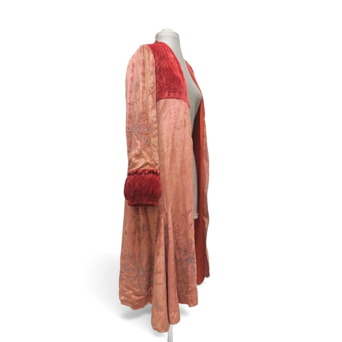 8044 - A pink velvet opera coat embroidered with beads and rhinestones, with gathered padded cuffs and yoke... 
