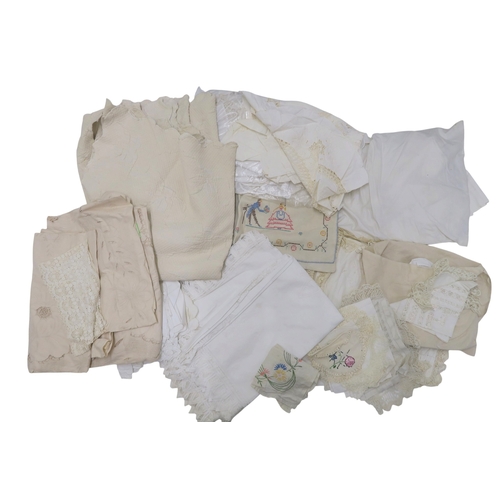 A collection of linens including embroidered and lace table linen, a ...