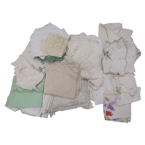 A collection of linens including embroidered and lace table linen, a ...