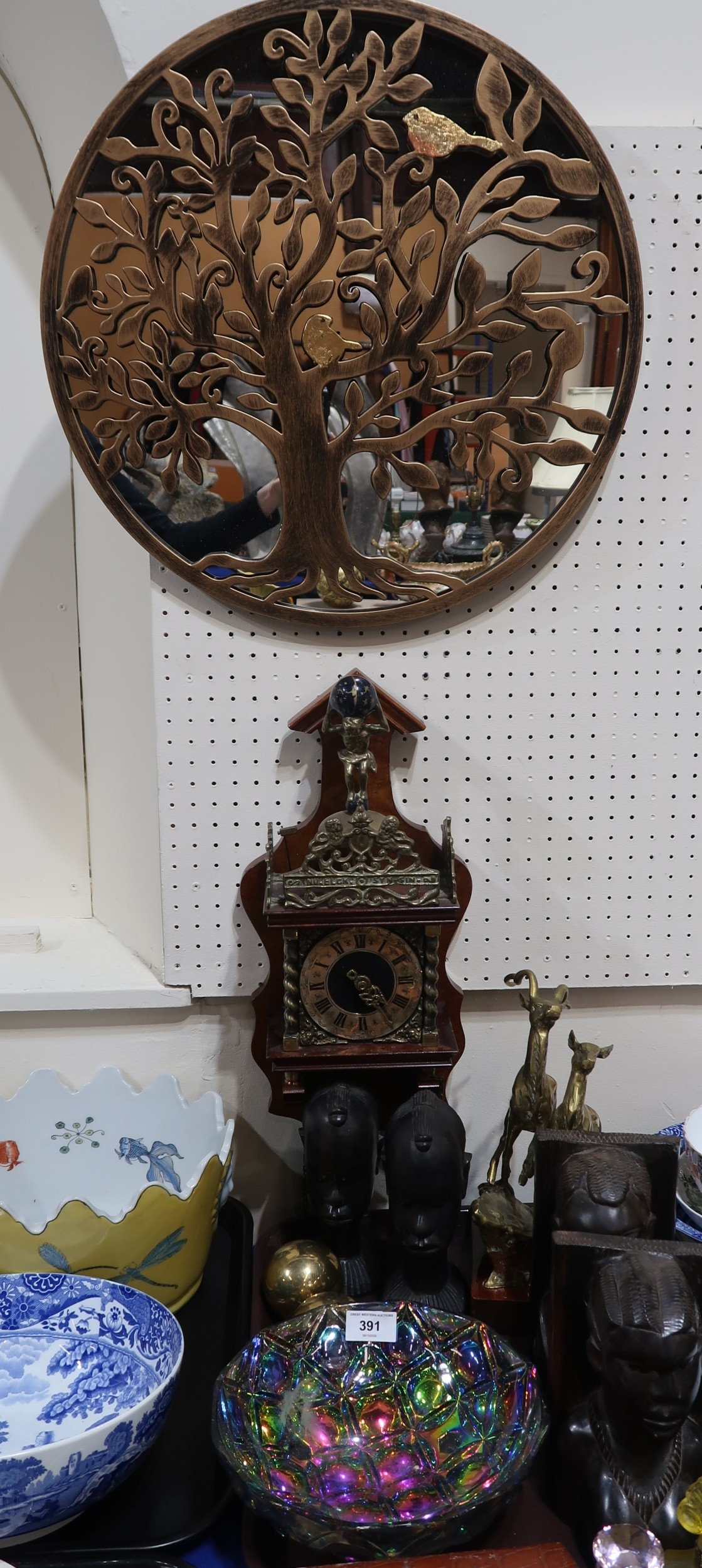 Two pairs of carved wood African heads, an Atlas wall clock, a birds in ...