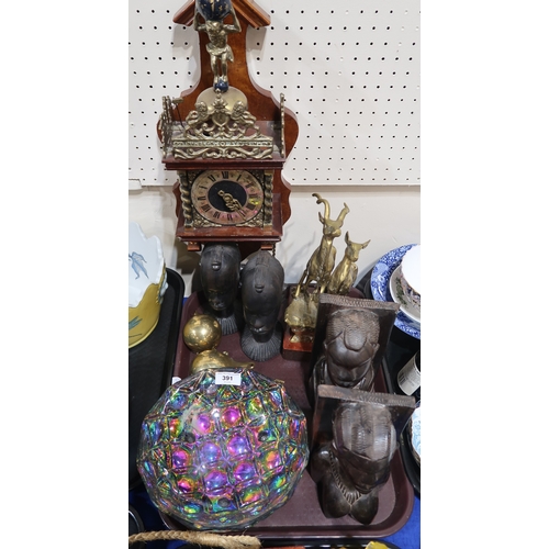 Two pairs of carved wood African heads, an Atlas wall clock, a birds in ...