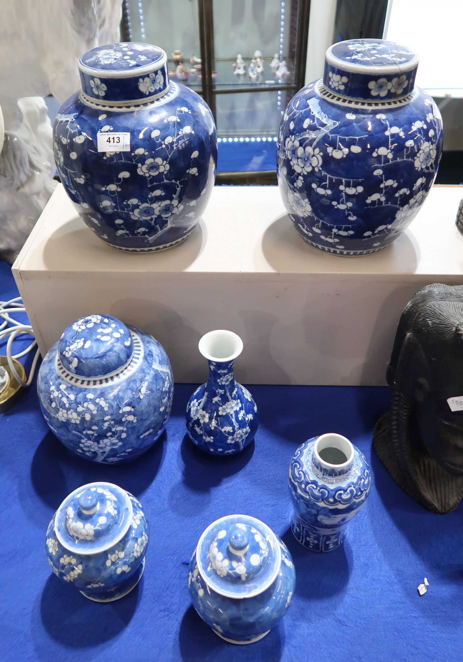 A pair of Chinese ginger jar, a further ginger jar, a pair of lidded ...