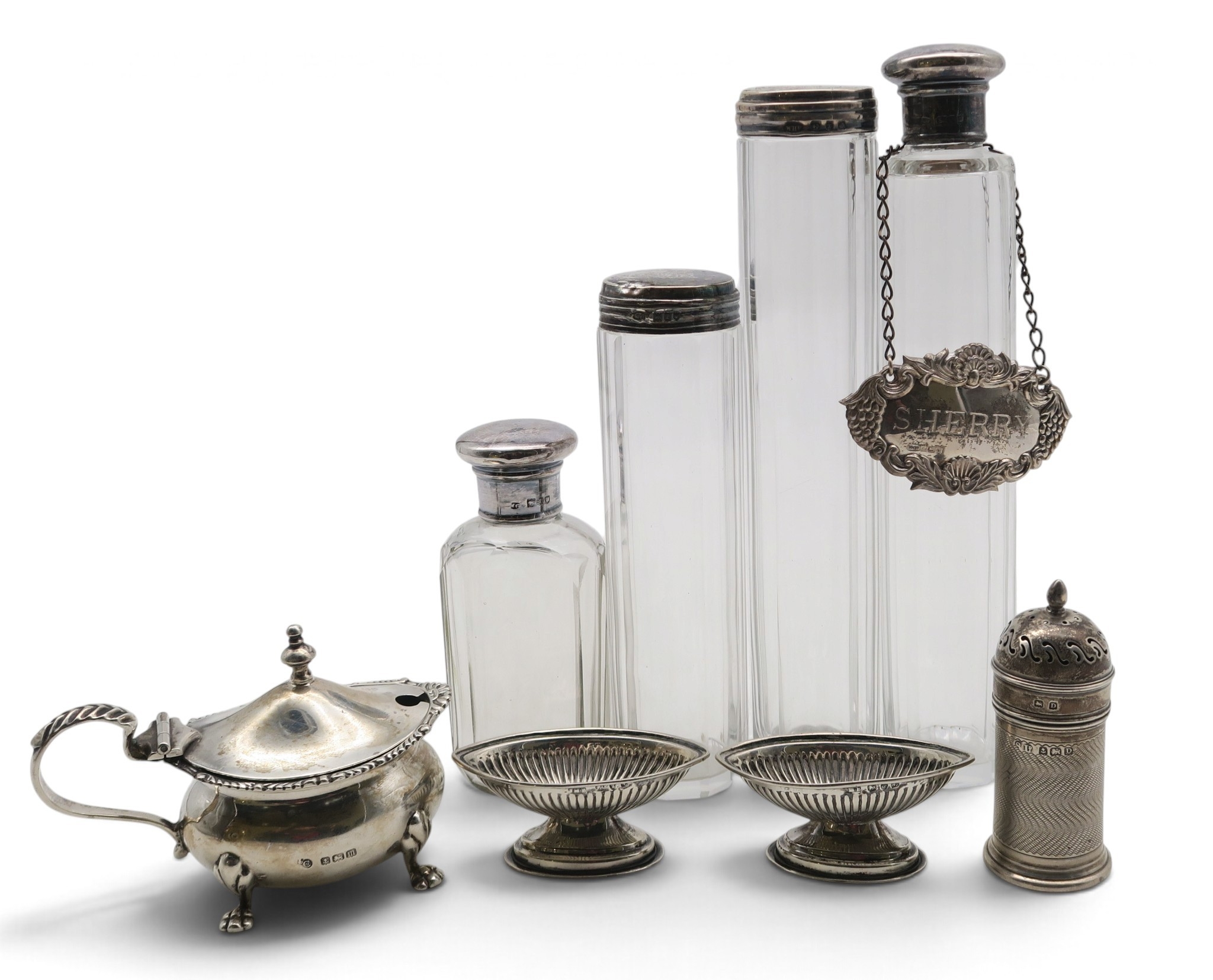 Four matched silver-topped decagonal dressing or vanity jars; a pair of ...