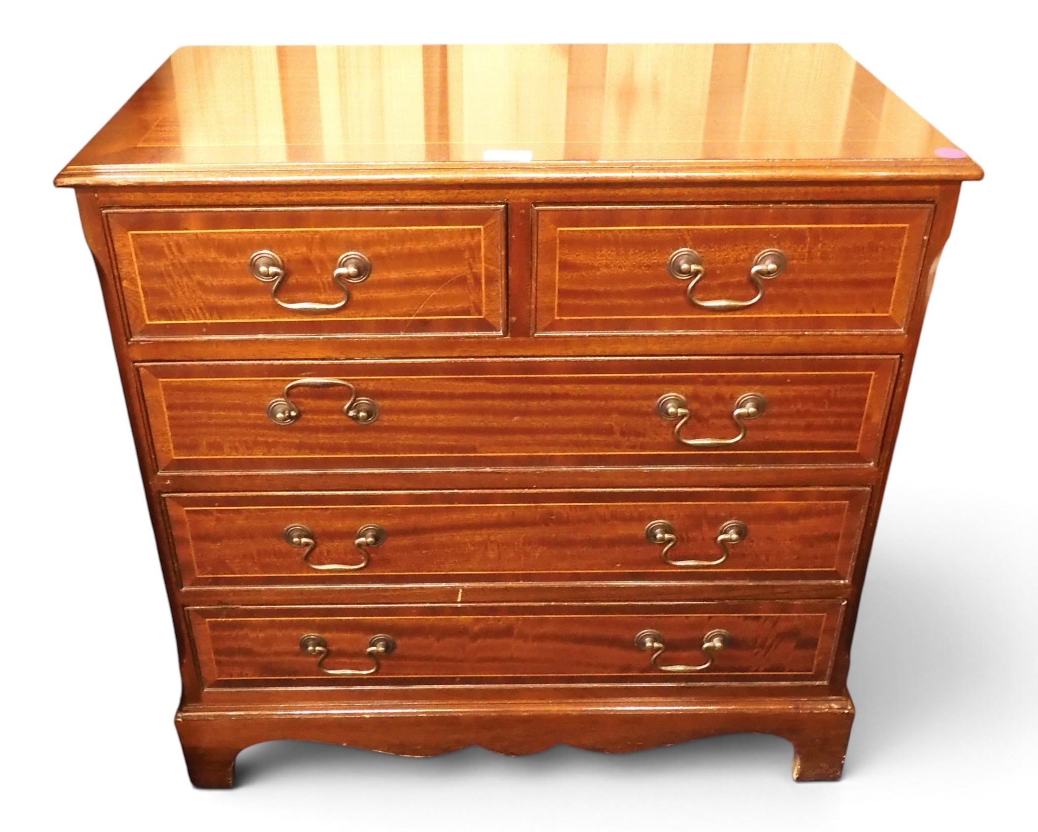 A small 20th century mahogany veneered two over three chest of drawers ...