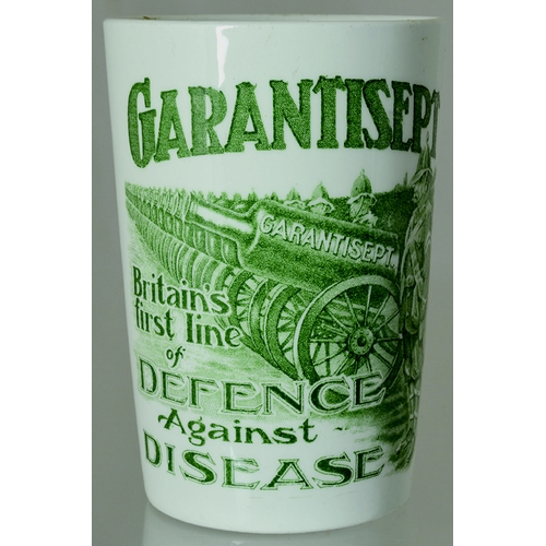 100 - GARANTISEPT BEAKER. 4.25ins tall, white glaze, green transfer GARANTISEPT/ BRITAINS/ FIRST LINE/ OF/... 