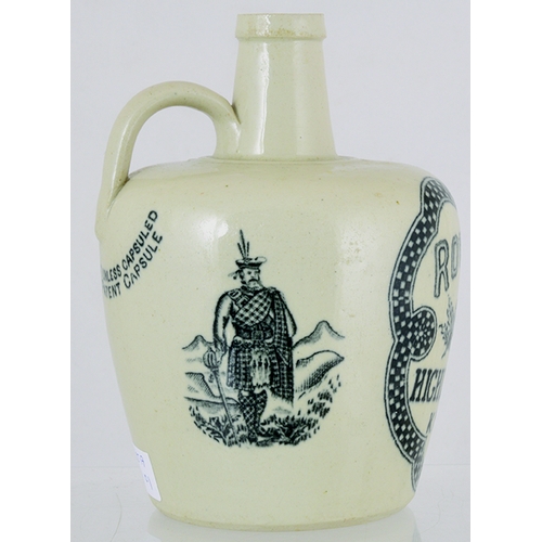 113 - ROB ROY HIGHLAND WHISKY JUG. (WG pg 127) 6.5ins tall, all white glaze, rear handle. Strong black tra... 