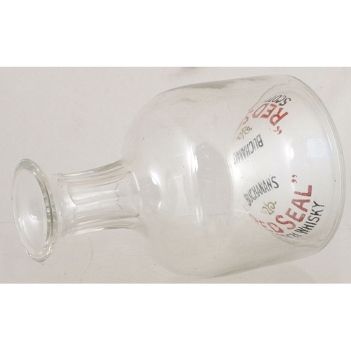 123 - BUCHANANS RED SEAL DECANTER. 7ins tall, clear glass. Raised base forming dome inside with BUCHANS/ R... 