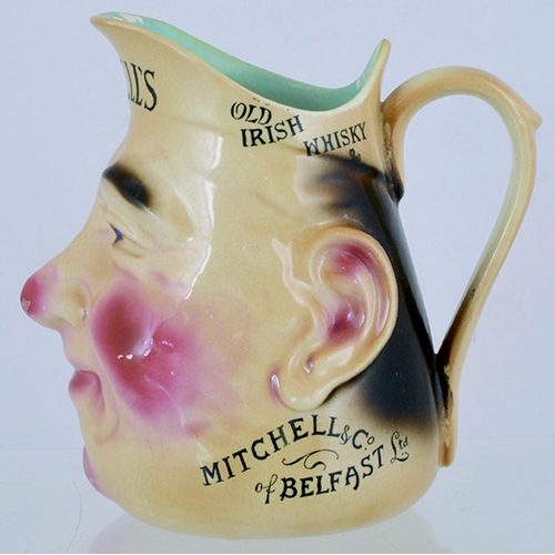 125 - BELFAST FACE JUG. 6ins tall, naturalistically modelled face jug for MITCHELLS / OLD/ IRISH/ WHISKY/ ... 