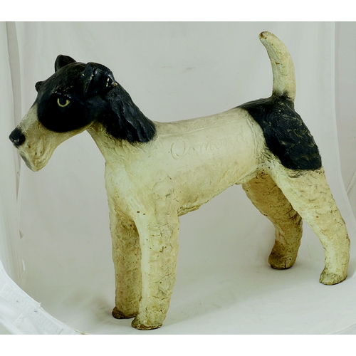 133 - OSMOND ADVERTISING FIGURE. 20ins tall, black & white figure of Welsh terrier dog, OSMOND impressed e... 