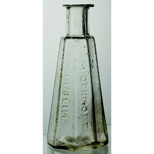 150 - DUBLIN FACETTED CURE. 4.5ins tall, clear glass. Embossed McDERMOT/ DUBLIN (N the wrong way round). B... 