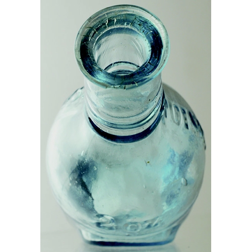 172 - QUINES POISON BOTTLE. (DP pg 34) 5ins long, ice blue glass. Embossed POISON either side below neck a... 