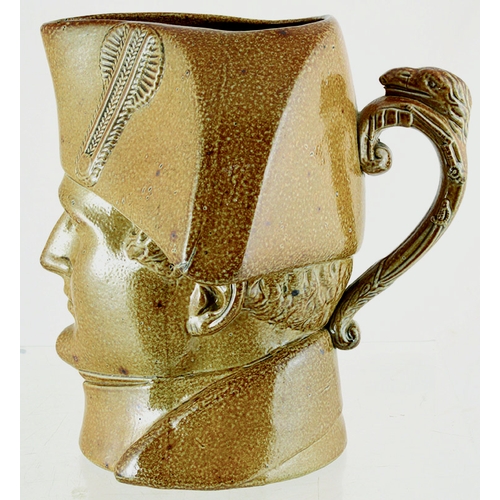 194 - NAPOLEON HEAD JUG. 7ins tall, variating tan salt glaze in form of bust of Napoleon. Rear handle. Ver... 