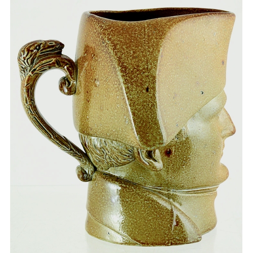 194 - NAPOLEON HEAD JUG. 7ins tall, variating tan salt glaze in form of bust of Napoleon. Rear handle. Ver... 