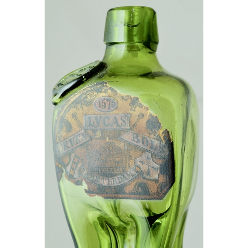 197 - PINCHED SEALED WAIST GIN BOTTLE. 8.5ins tall. Olive green glass. Short neck, applied lip, remnants o... 