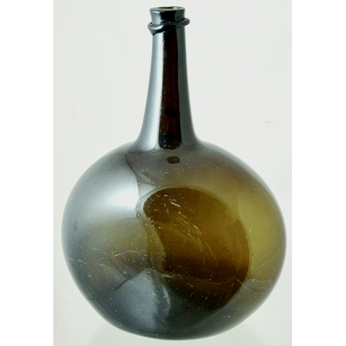 213 - FREEBLOWN CHESTNUT WINE. 12ins tall. Dark brown/ green/ black glass flattened chestnut shape with lo... 