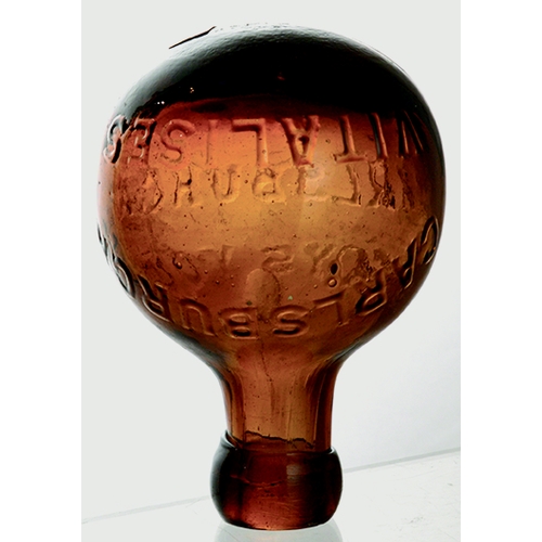 54 - ROUND BOTTOMED SELTZER. 4.75ins tall. Unusual deep red/ amber glass. Embossed CARLSBURGA/ VITALISES ... 