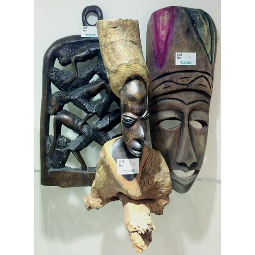 134 - TRIBAL ART WOOD CARVINGS. Tallest 12ins, one mask type, wall plaque plus seated ornament. (3)