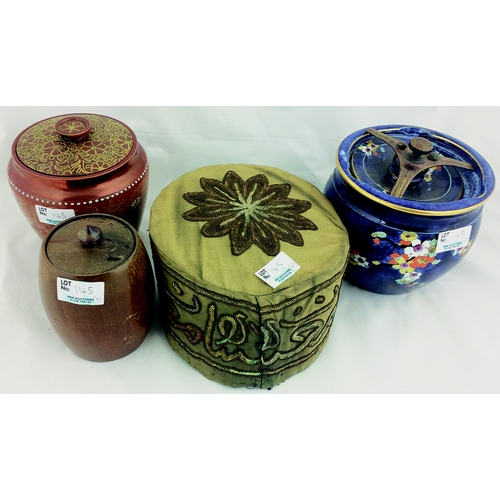 145 - TOBACCO JAR GRP. Tallest 6ins, wooden & ceramic decorative lidded jars plus old smoking hat. (4)