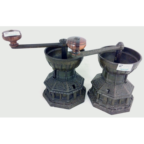 199 - A. K & SONS COFFEE GRINDERS DUO. 7.5ins, heavy metal, hand cranked, decorative pattern.