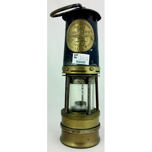 202 - LEEDS MINERS LAMP. 10ins, embossed badge, Hailwood & Ackroyd Ltd, with hook for handle.