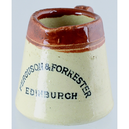 595 - MINIATURE AMMONIA MEASURE. 1.5ins tall, t.t., handled jug FERGUSON & FORRESTER/ EDINBURGH in black l... 